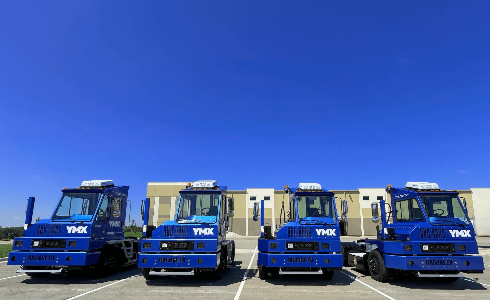YMX Logistics EV yard tractors Orange EV