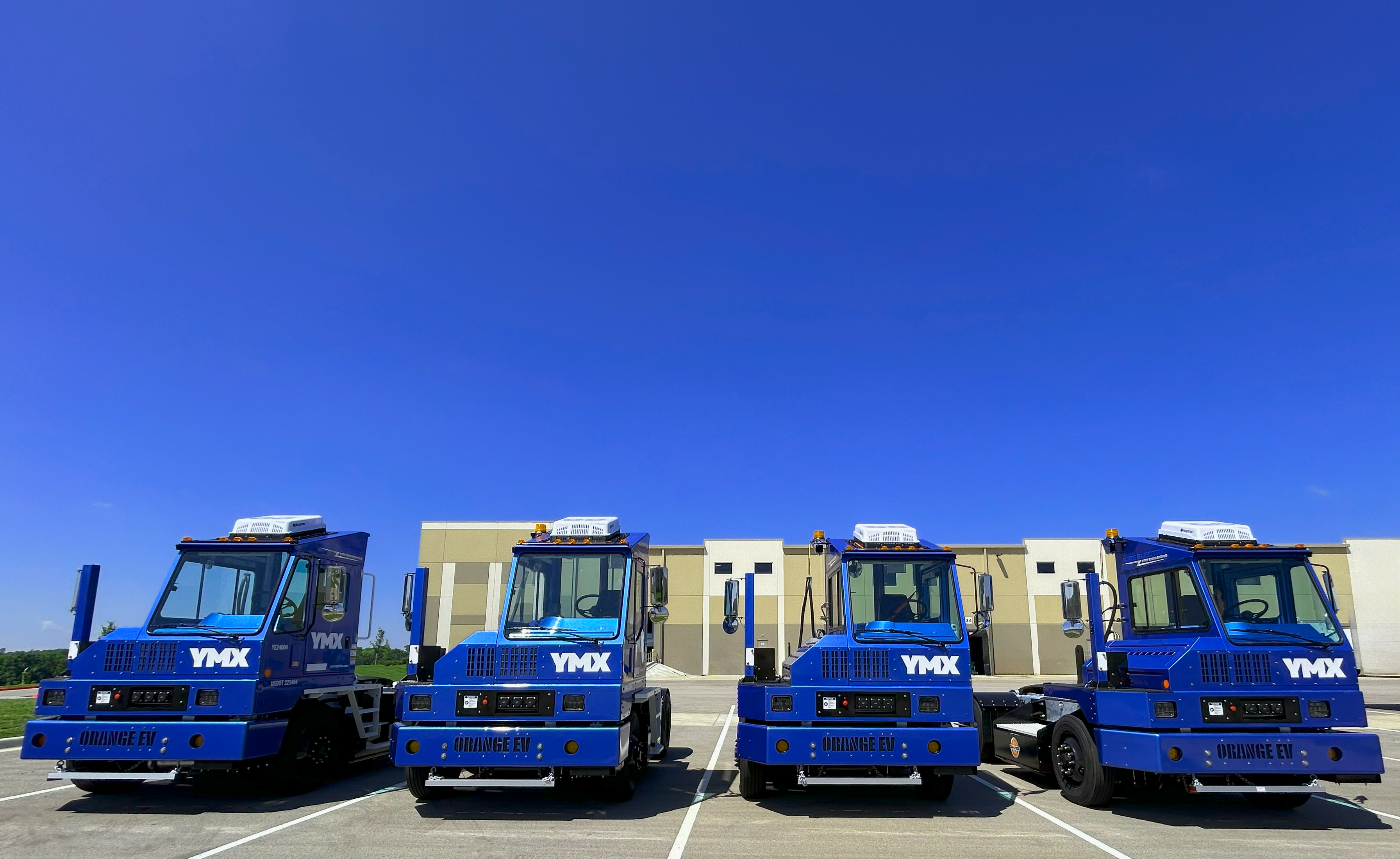 YMX Logistics EV yard tractors Orange EV